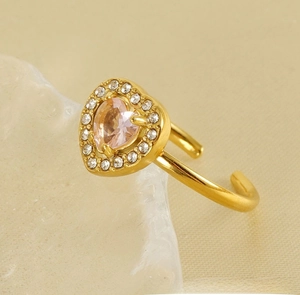 Macro shot of 18K gold-plated double-layer heart ring with pink zircon and micro-inlay