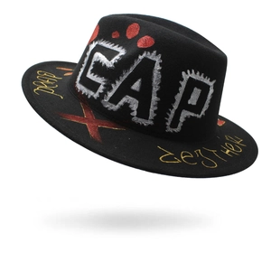 Black wool jazz hat with silver CAP graffiti and gold designer script on a wide brim