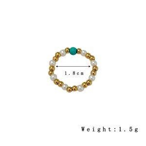 Elastic beaded ring featuring 18K gold beads, freshwater pearls, and turquoise stone