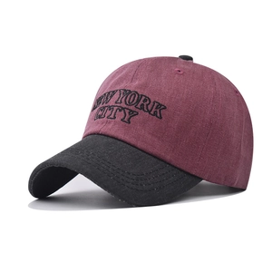 Close-up of vintage burgundy washed cotton baseball cap with New York City embroidery