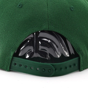 Close-up of adjustable snapback closure and precise stitching on dark green baseball cap