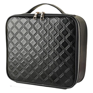 Black quilted large capacity travel makeup bag with leather handle and gold double zipper
