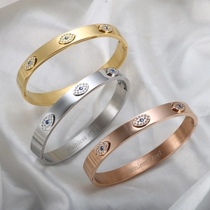 Three minimalist stainless steel evil eye bracelets in gold, silver and rose gold