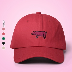 Detail of red cotton baseball cap with pig embroidery and multi-color options available