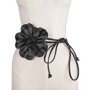 Bohemian PU leather waist rope with a large black floral ornament on a mannequin