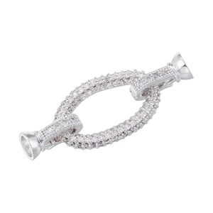 Detailed view of silver oval connector clasp with pave rhinestones and trumpet end caps