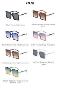 Detailed flat lay of oversized square sunglasses featuring stylish gold metal chain temples