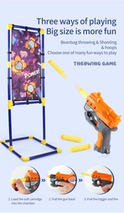 Détail du jeu de cible dinosaure 3-en-1 avec pistolet à fléchettes et sacs de tir filet
