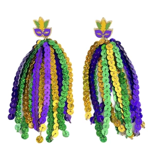 Close-up of Mardi Gras mask earrings featuring vibrant purple green and gold sequins