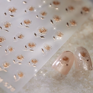 Metallic rose gold 3D embossed floral nail art stickers with intricate relief texture