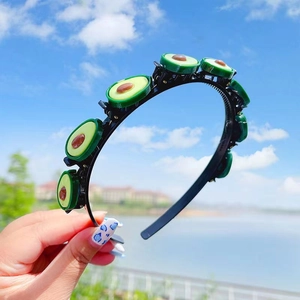 Sweet avocado cartoon headband for girls featuring green resin charms on a slim black band
