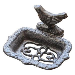 Vintage cast iron bird soap dish with decorative cutout drainage holes for gardens