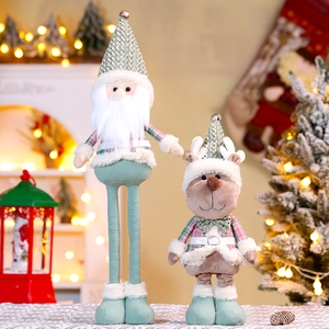 Detail of plush Christmas gnomes with telescopic legs and soft green knitted fabrics
