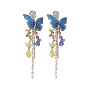 Elegant butterfly tassel earrings with blue butterfly, purple beads, and golden leaves
