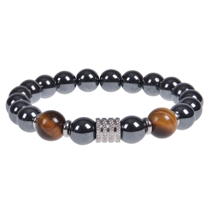 Close-up of 10mm black obsidian and tiger eye beads with silver spacers on white background