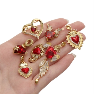 Detail of 18K gold plated heart charms with red zircon and Mom I love you engraving