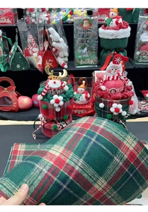 Macro detail of red and green plaid fabric for Christmas gift box flower packaging material