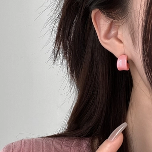 Pink C-shaped resin stud earrings for women featuring a glossy finish and minimalist design