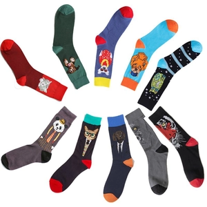 Flat lay of ten assorted cotton crew socks with colorful cartoon animal patterns