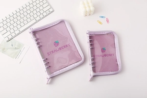 Detail showing two sizes of purple clear PVC strawberry binder covers with zip closure