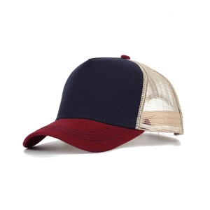 Close-up of contrast mesh trucker cap with navy front, burgundy brim, and beige mesh