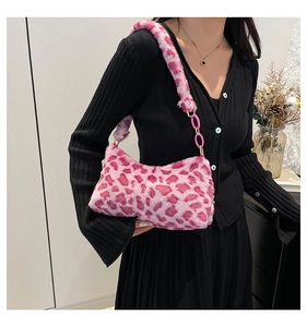 Close-up of pink leopard print plush shoulder bag with chunky plastic chain and gold buckle