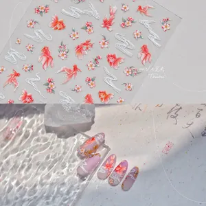 Detail of koi fish nail stickers with cherry blossoms and relief texture on nails