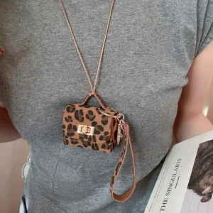 Leopard print mini bag pendant with gold buckle on a stylish neck cord for women