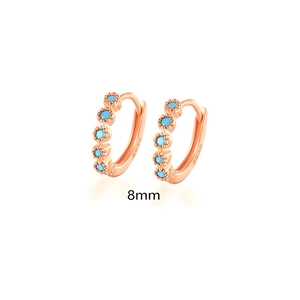 Detail of 8mm rose gold S925 sterling silver hoop earrings with blue gemstones