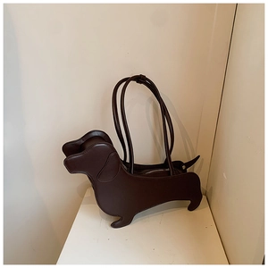 Close-up of creative dachshund-shaped dark brown faux leather tote bag with slim handles