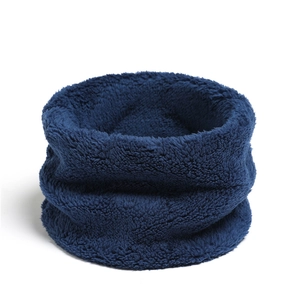 Detailed close-up of soft navy blue coral fleece neck warmer for winter protection