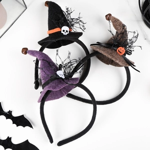 Halloween witch hat headbands with lace spiders and pumpkins on marble background