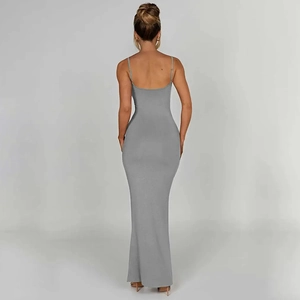 Detail view of the back of a grey backless bodycon maxi dress with slender straps