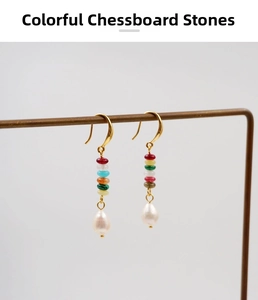 Detailed shot of multi-color stone earrings with teardrop freshwater pearls