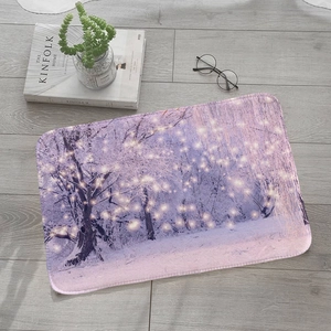 Absorbent flannel snow forest winter rug with purple trees on a gray wood floor