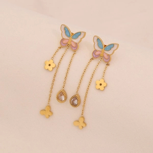 Close-up of golden tassel earrings featuring colorful enamel butterfly and zircon charms