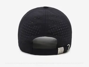 Detail view of the laser-cut mesh holes and metal adjustable buckle on black baseball cap