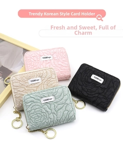 Close-up of assorted accordion card holders with 3D rose floral embossed texture and keychain