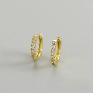 Detailed view of gold hoop earrings with micro-paved cubic zirconia crystals
