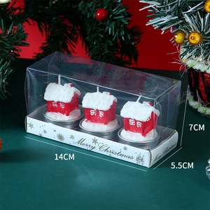 Three red Christmas cabin candles in a PVC gift box with dimensions 14x5.5x7CM