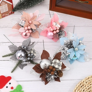 Artistic PVC Christmas floral picks with glitter leaves and pine cones on white wood