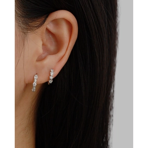 Elegant S925 sterling silver star and pavé zircon hoop earrings on female model