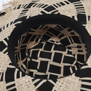 Two-tone raffia sun hat with checkerboard weave and fringed edges for beach holidays
