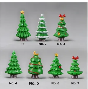 Detailed collection of 7 miniature resin Christmas trees in various green festive designs