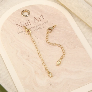 Detail of 18k gold plated extension chains with lobster clasp and tulip pendant charms