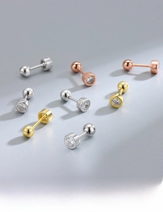 Detail view of S925 silver stud earrings with cubic zirconia and thick gold plating
