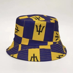 Detail of yellow and blue checkered bucket hat featuring a black trident pattern print