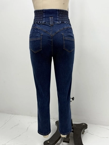Detailed back view of high-waisted stretch denim jeans with V-shaped yoke and rear pockets