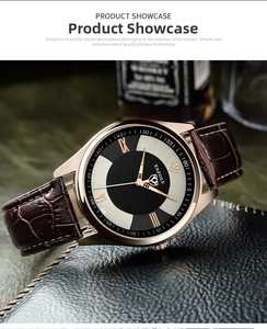Detail of rose gold business watch with brown crocodile leather strap and black-white dial