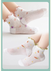 Detail of breathable mesh cotton socks for toddlers with cute fruit prints and ruffle cuffs